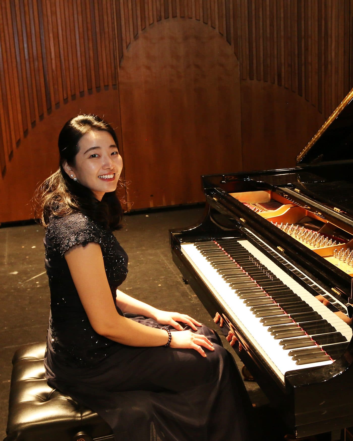 Yeaseul Kim seated at a grand piano